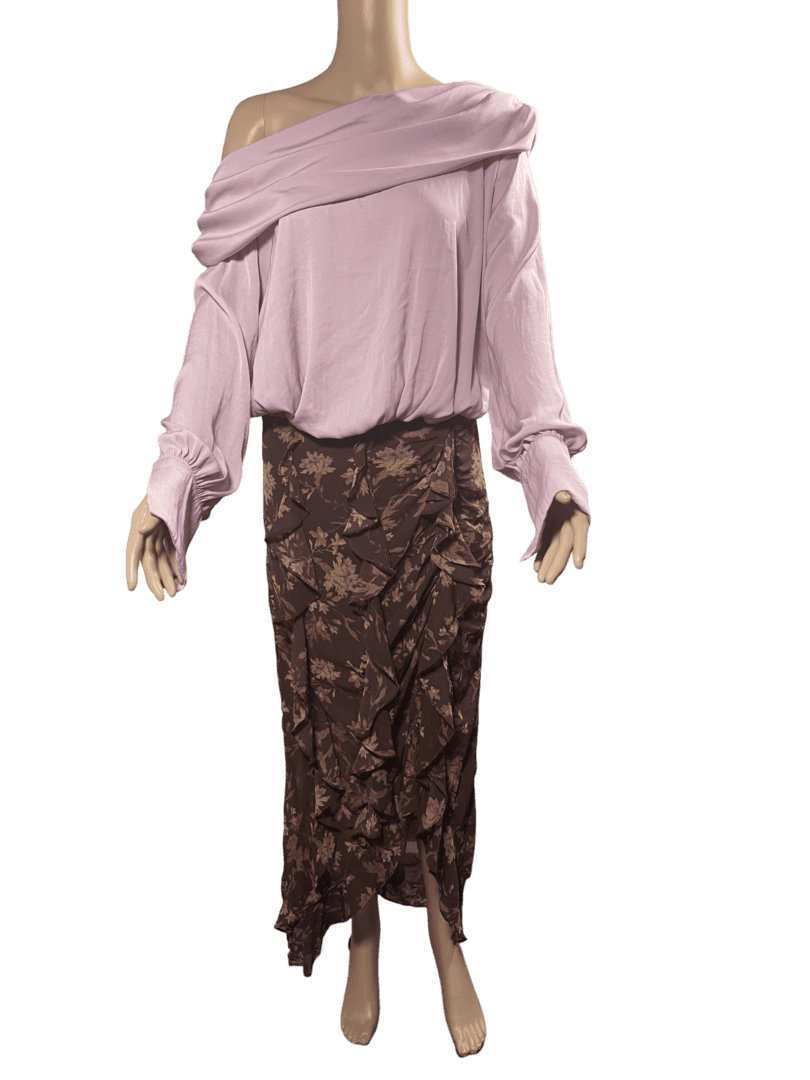 Outfit featuring a loose pink top and a brown floral midi skirt.