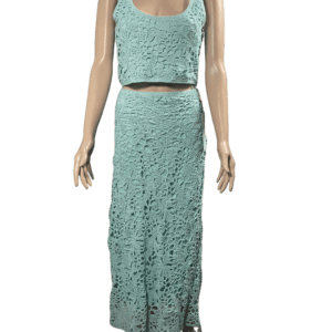 A sleeveless teal lace dress with a crop top and matching skirt.