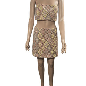 Fashion model wearing a matching geometric-patterned crop top and skirt set.