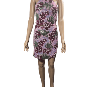 Woman wearing a pink floral sleeveless dress.