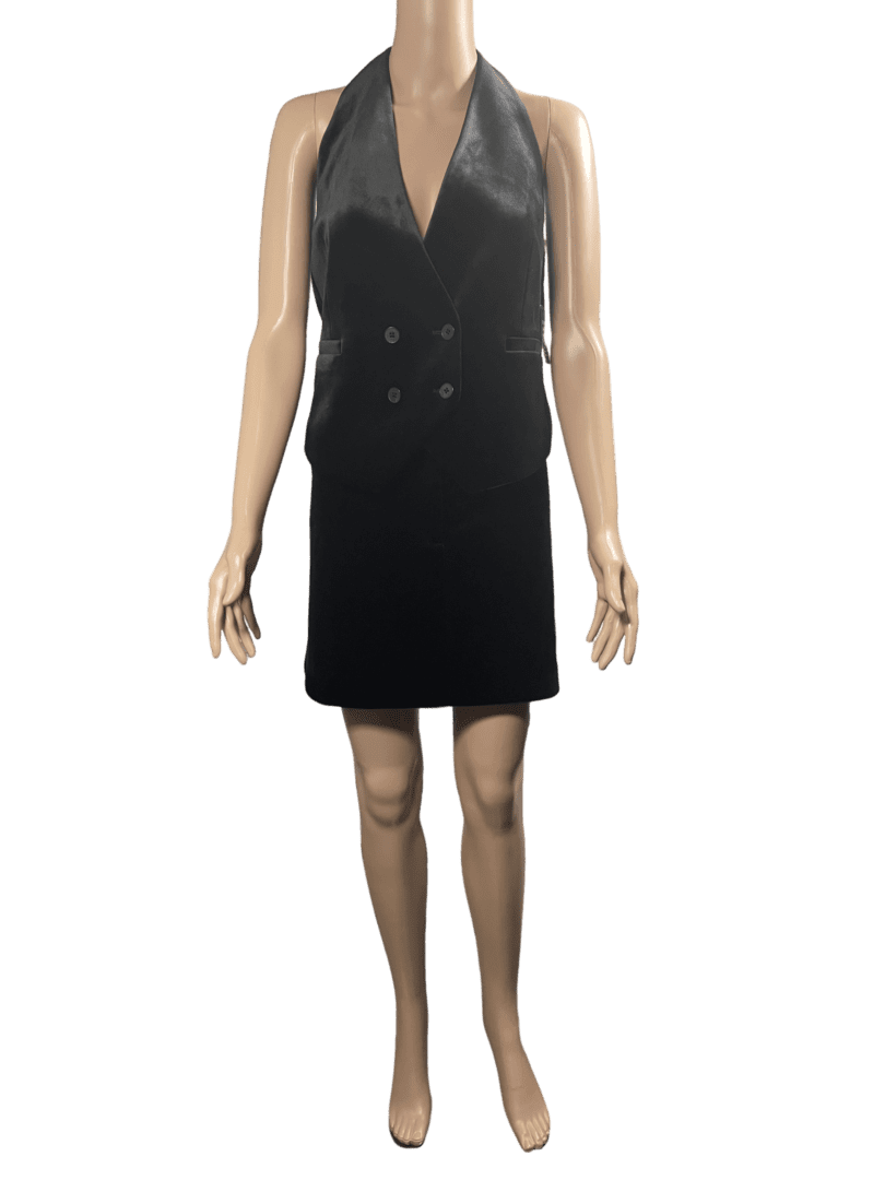 A sleeveless black dress with a deep V-neckline.