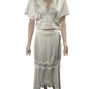Elegant white blouse and long skirt outfit with ruffle details.