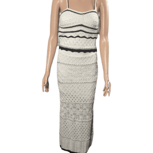 Sleeveless white maxi dress with black trim and crochet details.