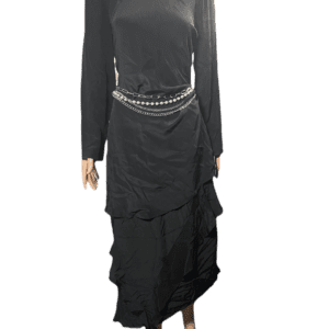 Elegant black dress with layered ruffles and a jeweled belt detail.