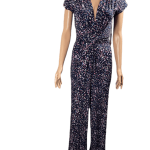 Female mannequin wearing a black floral jumpsuit with short sleeves.