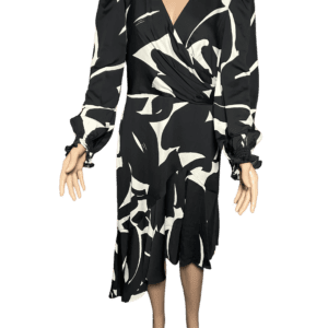 Black and white abstract patterned dress with long sleeves and asymmetrical hem.