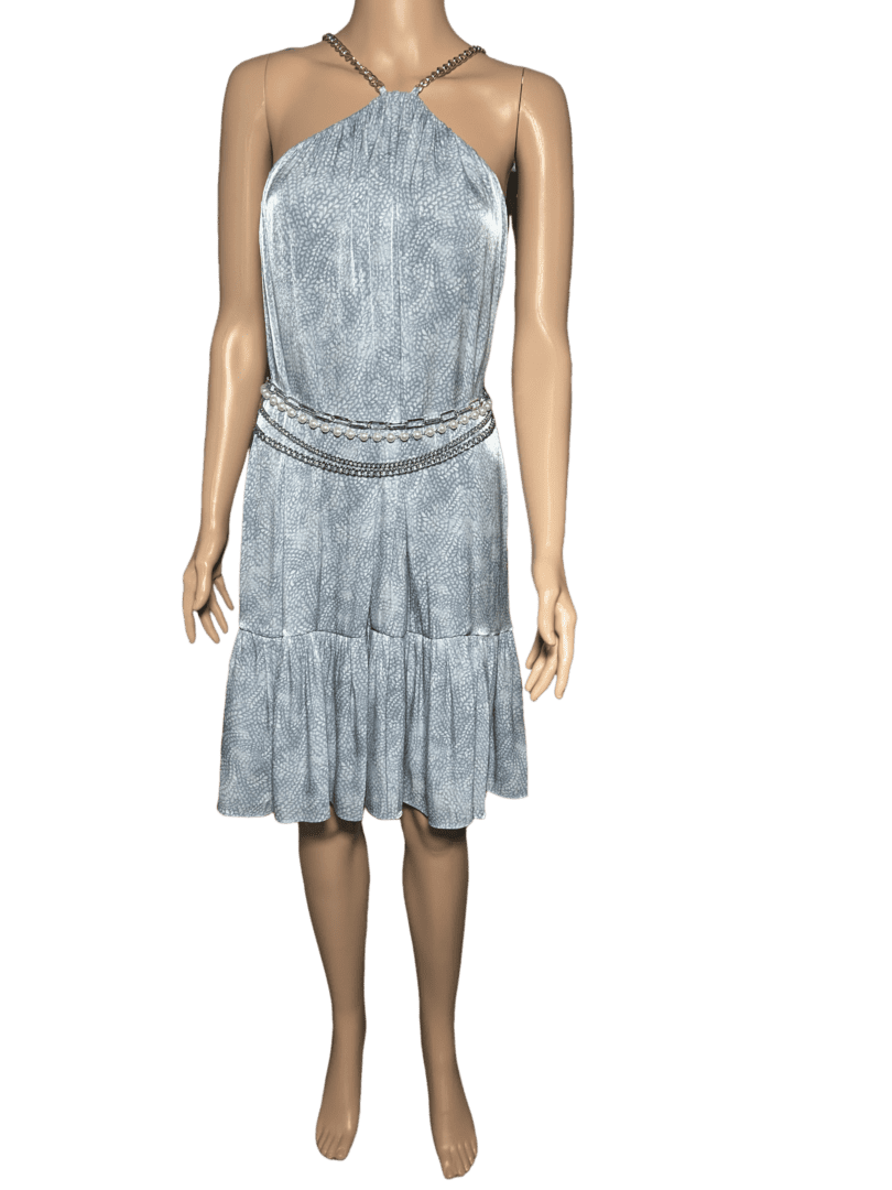 A sleeveless, knee-length gray dress with a cinched waist worn by a mannequin.