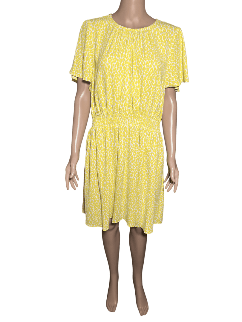 Yellow knee-length dress with puff sleeves and cinched waist.