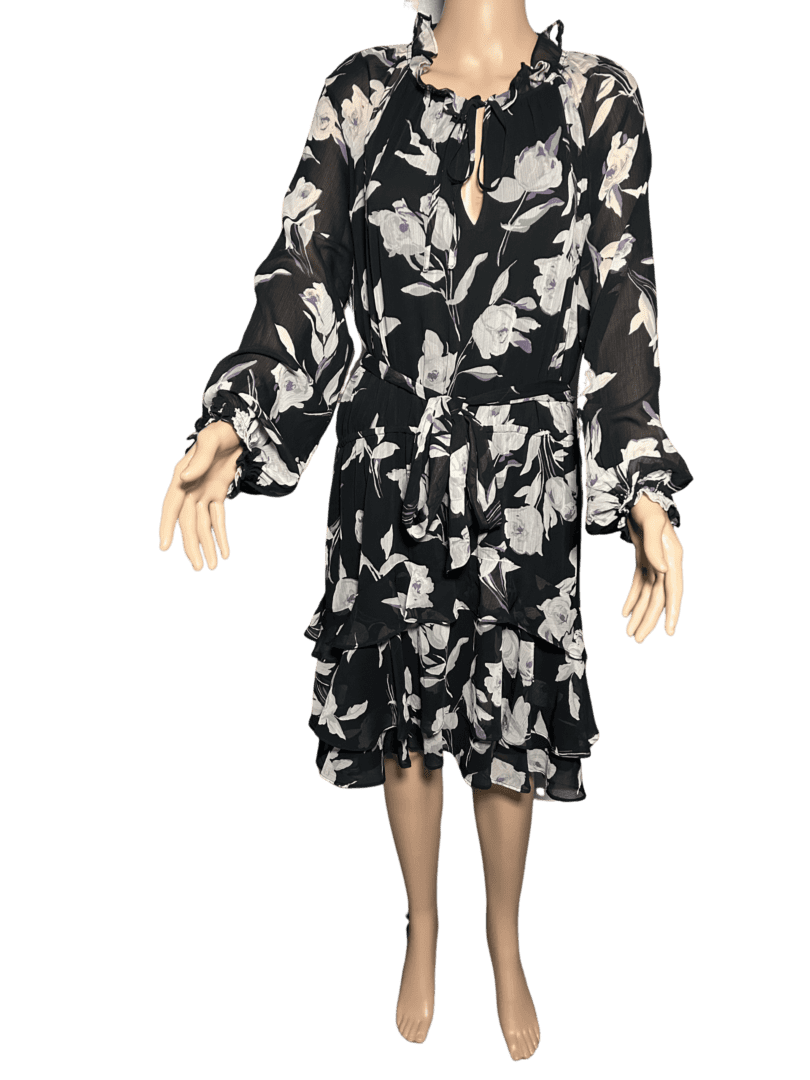 Black and white floral long-sleeve dress with a tiered skirt.
