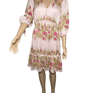 Floral pink dress with ruffled hem and puffed sleeves.