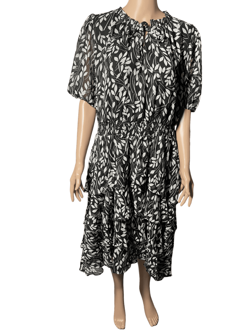 Black and white floral midi dress with short sleeves and a tiered skirt.