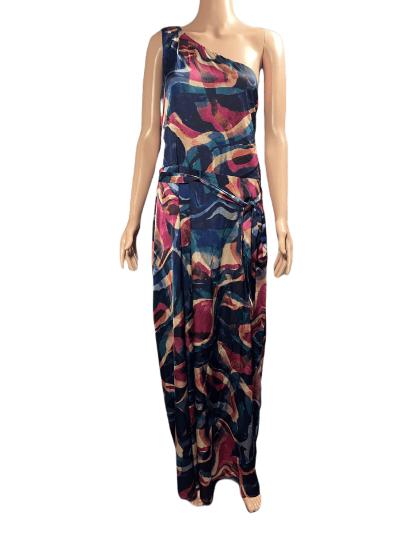 Woman wearing a colorful, abstract-patterned maxi dress.