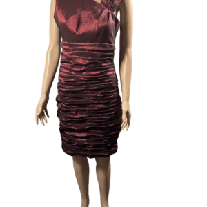 Woman wearing a burgundy ruched satin dress.