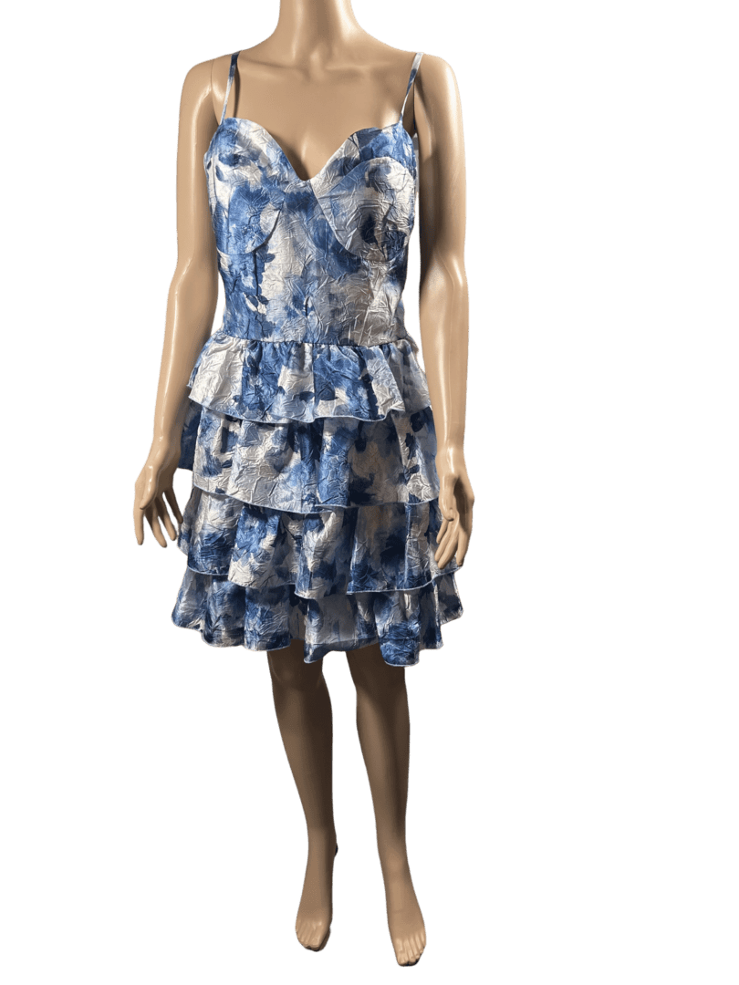 Blue and white floral sleeveless dress with layered ruffles.