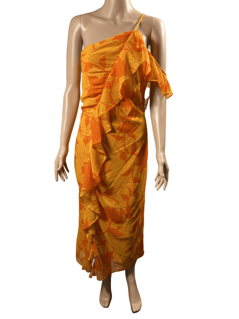 A mannequin dressed in an orange and yellow tie-dye sari.