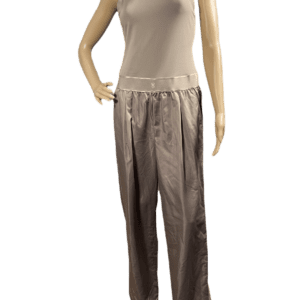 Satin wide-leg pants paired with a sleeveless beige top on a mannequin.