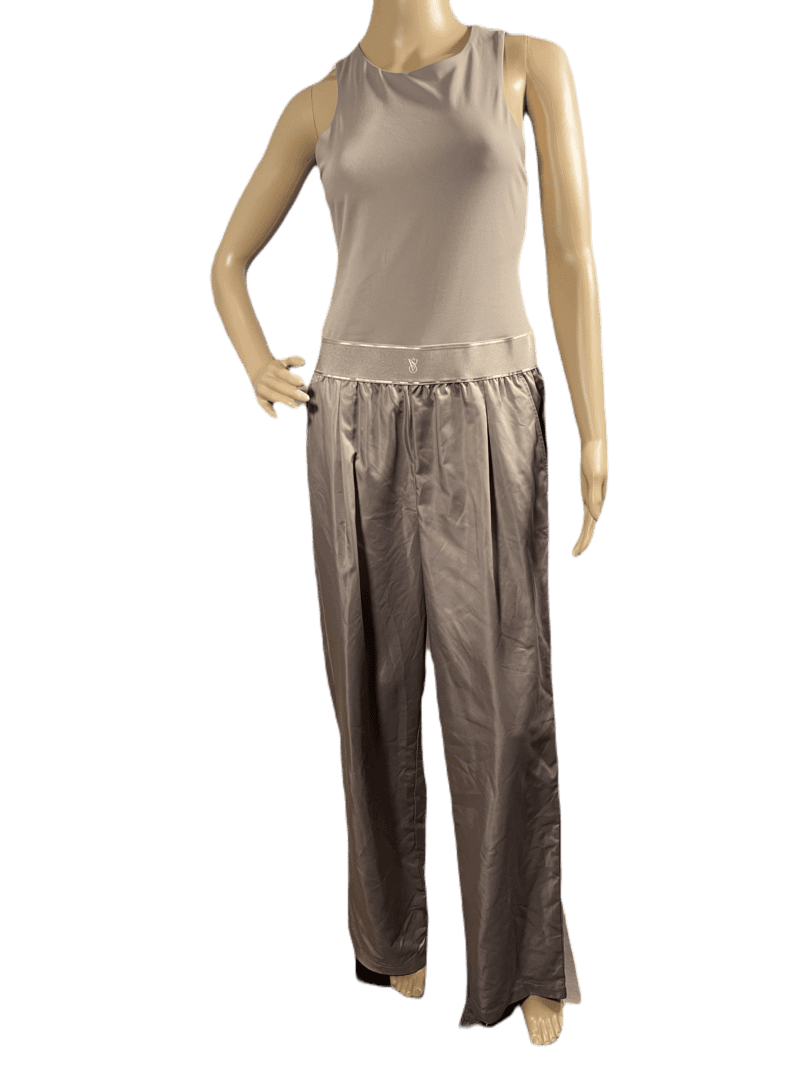Satin wide-leg pants paired with a sleeveless beige top on a mannequin.