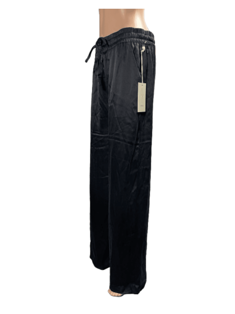 Black high-waisted pants with a belt and tag attached.