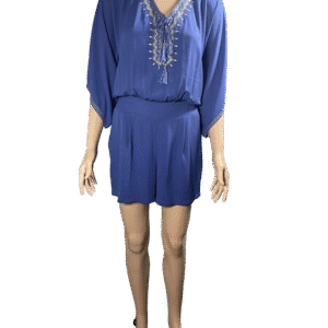 Woman wearing a blue dress with lace-up neckline.