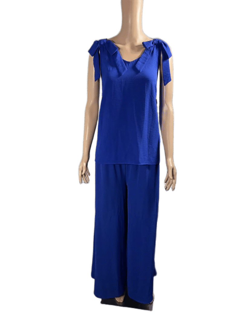 Woman wearing a blue sleeveless top and wide-leg pants outfit.