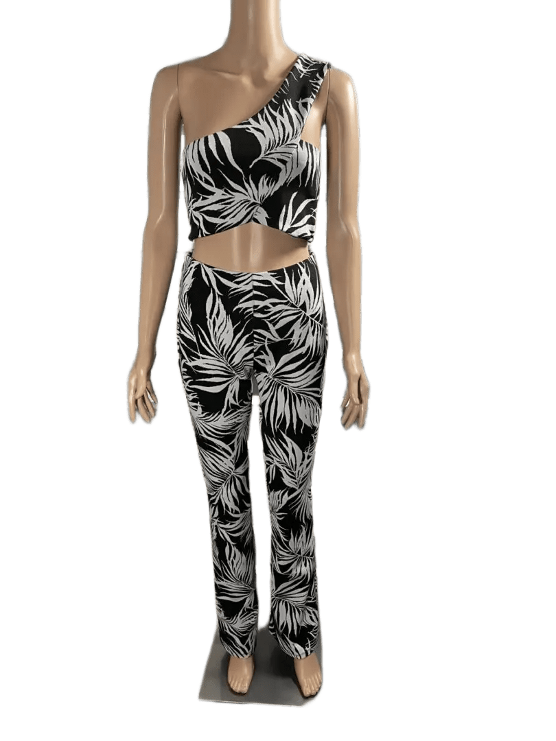 Fashionable black and white tropical print outfit with cutout detail.