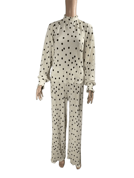 Beige pajama set with black polka dots, featuring long sleeves and pants.
