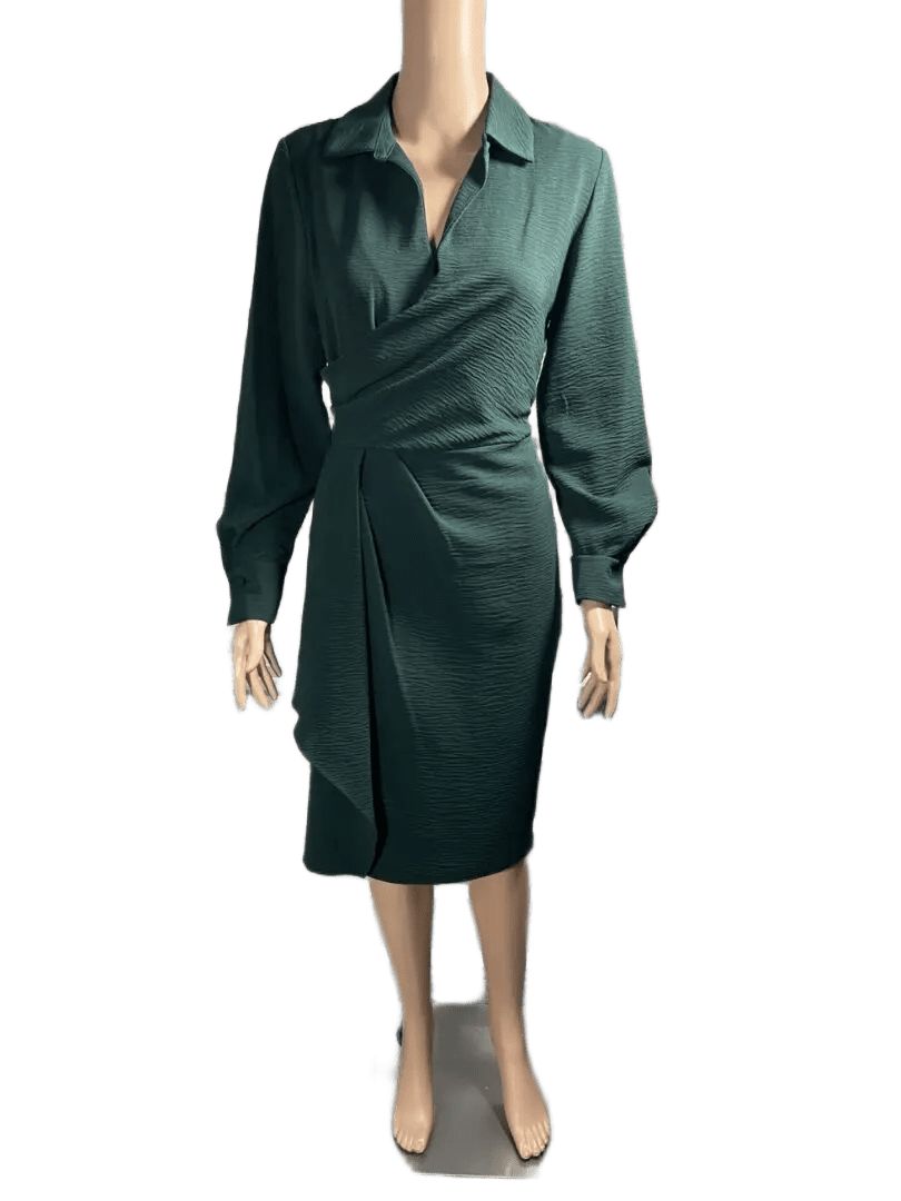 Woman wearing a dark green long-sleeve wrap dress.