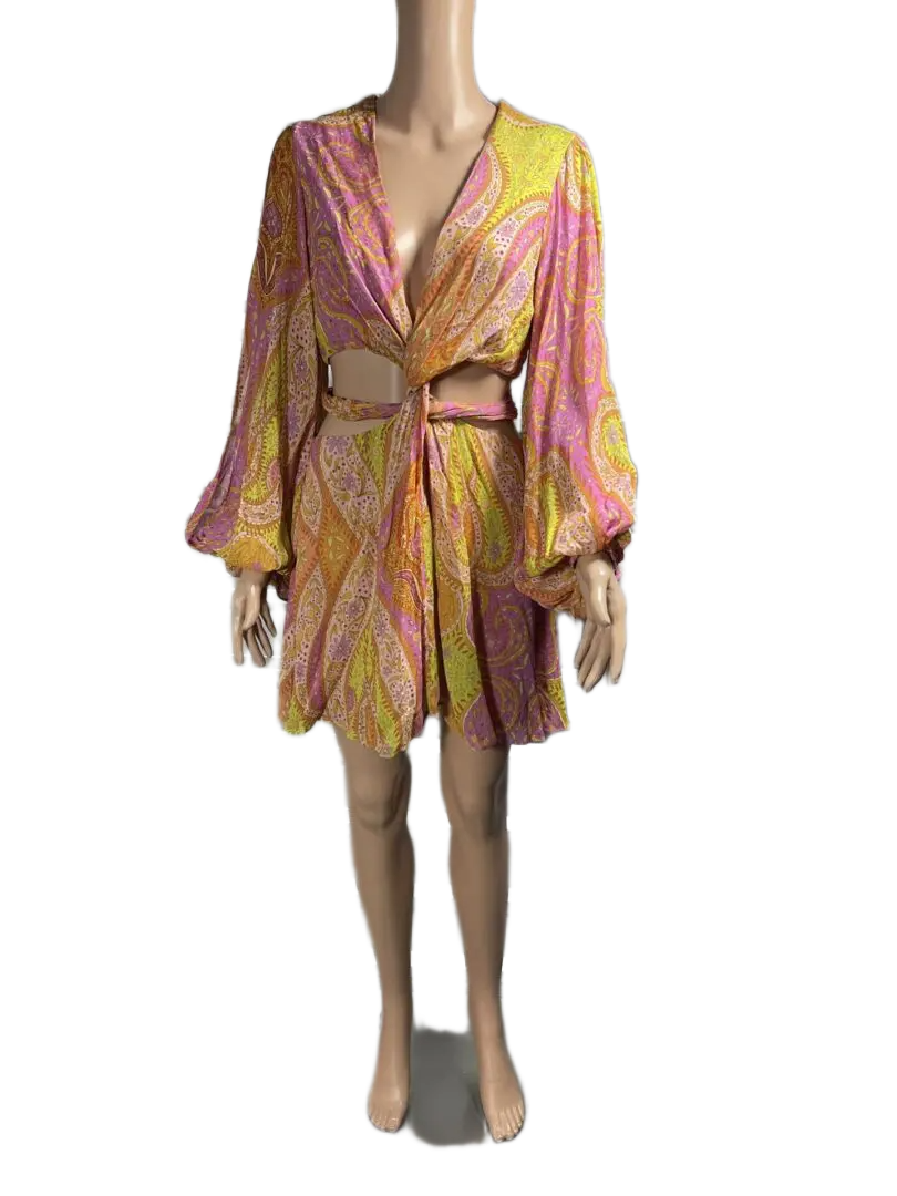 A colorful, flowy wrap dress with long sleeves and a belt.