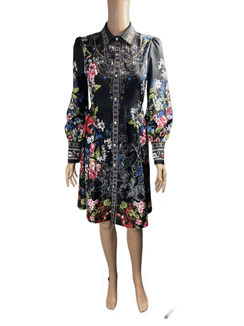 A long-sleeved floral patterned dress with a dark base color.