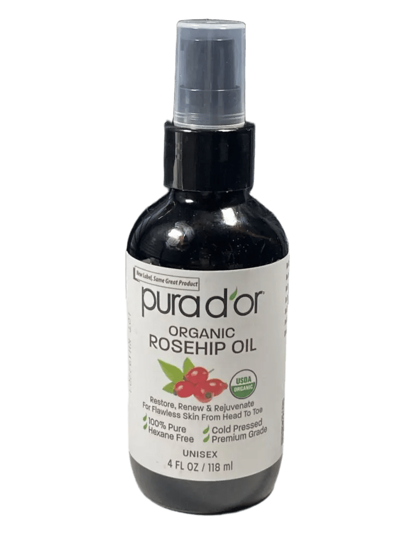 A bottle of Pura d'or Organic Rosehip Oil with a spray cap.