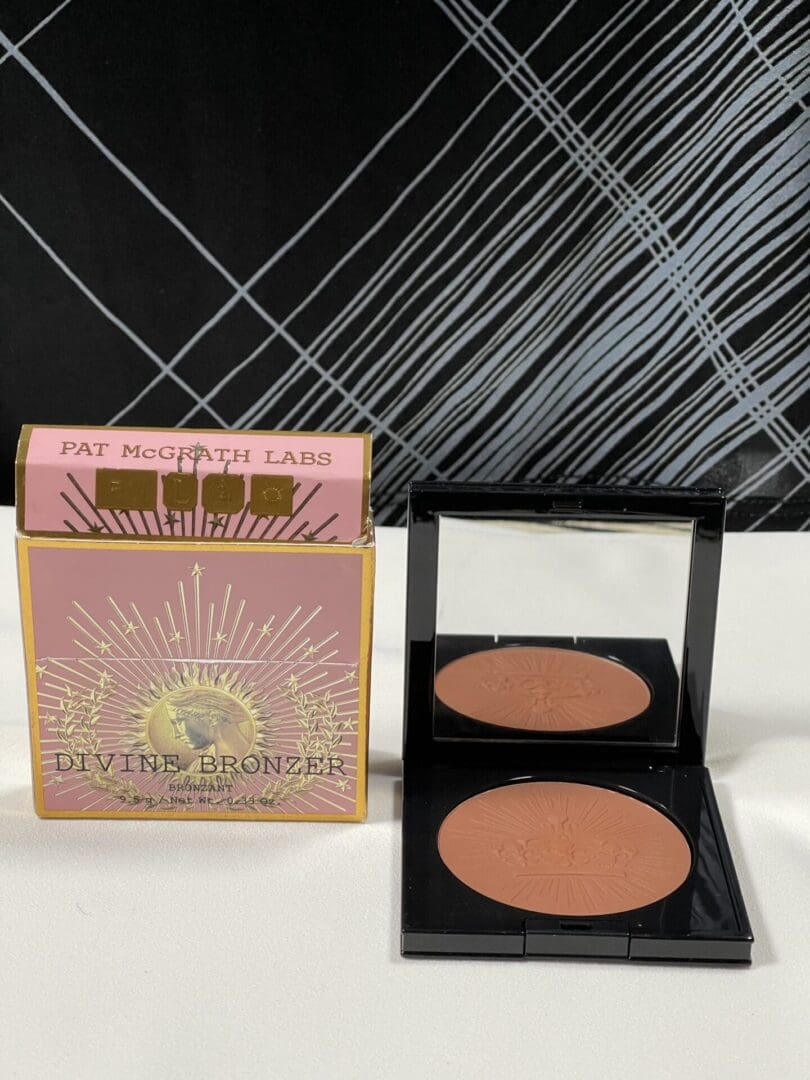 Wet n Wild blush with packaging and brush.