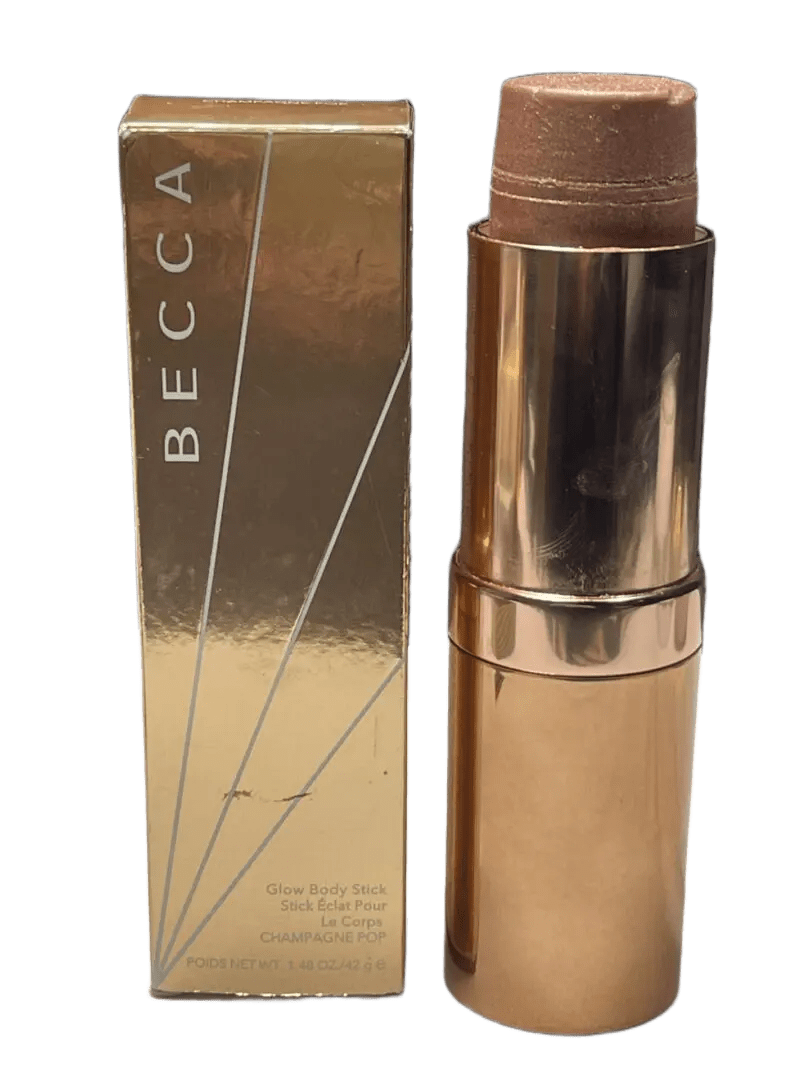 BECCA shimmering skin perfector stick with its golden packaging.