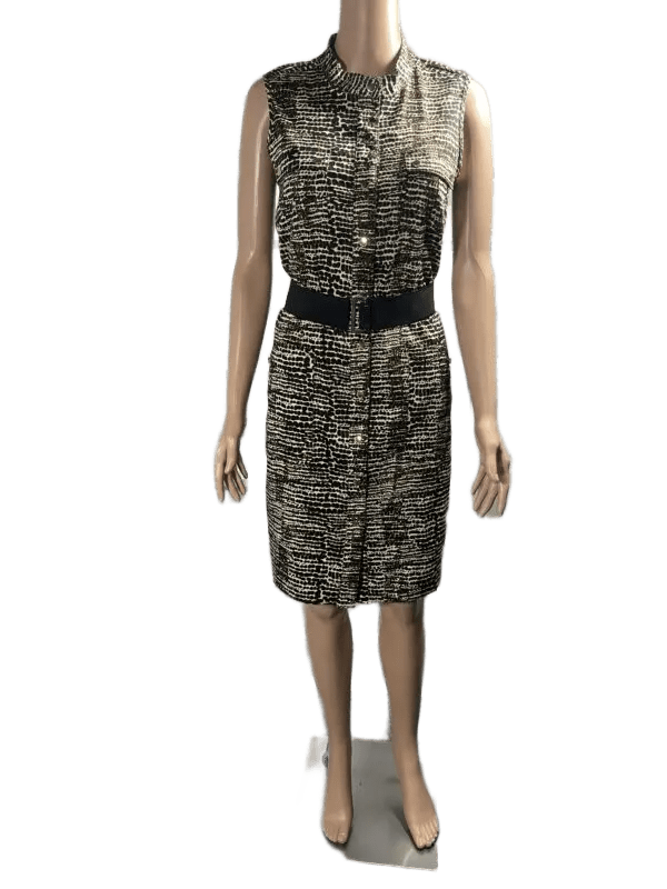 Sleeveless knee-length dress with black belt and abstract pattern.