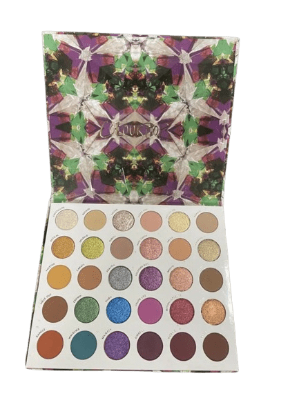 Open eyeshadow palette with a variety of colorful shades and a vibrant abstract cover.