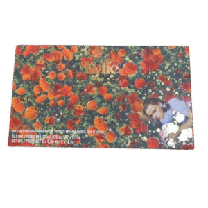 Colorful postcard featuring a field of orange flowers and a dog.