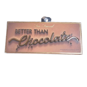 A sign saying 'Better Than Chocolate' in elegant script.