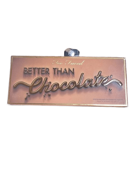 A sign saying 'Better Than Chocolate' in elegant script.