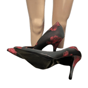 Pair of black high heels with red floral patterns.