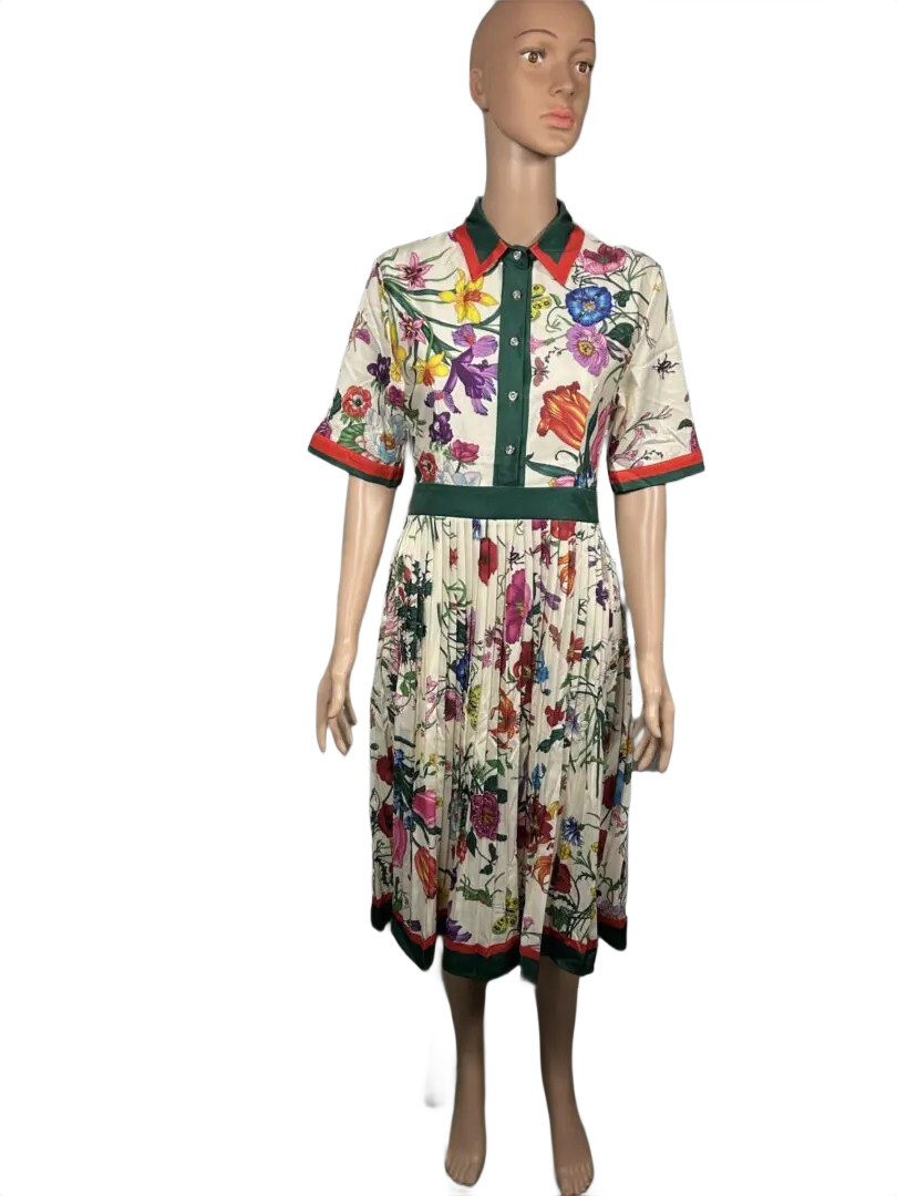 Floral midi dress with black belt and colorful pattern.