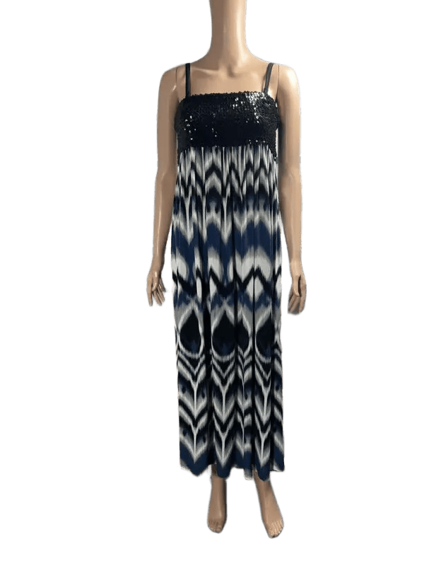 Woman wearing a black and white patterned maxi dress.