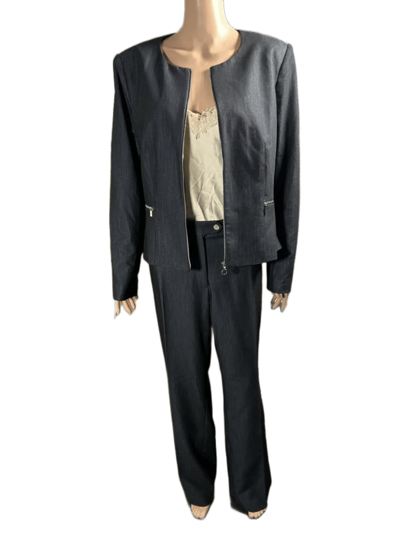 Black pinstripe suit with beige blouse on mannequin.