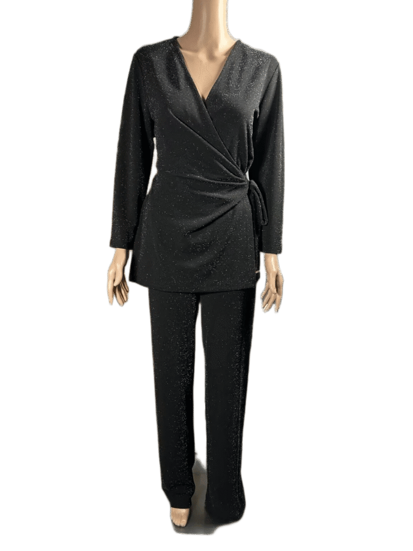 Black long-sleeve wrap top paired with black straight-leg pants.