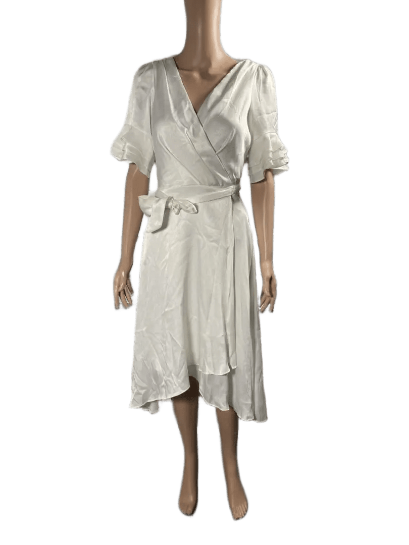 White wrap dress with puff sleeves and a tie waist.