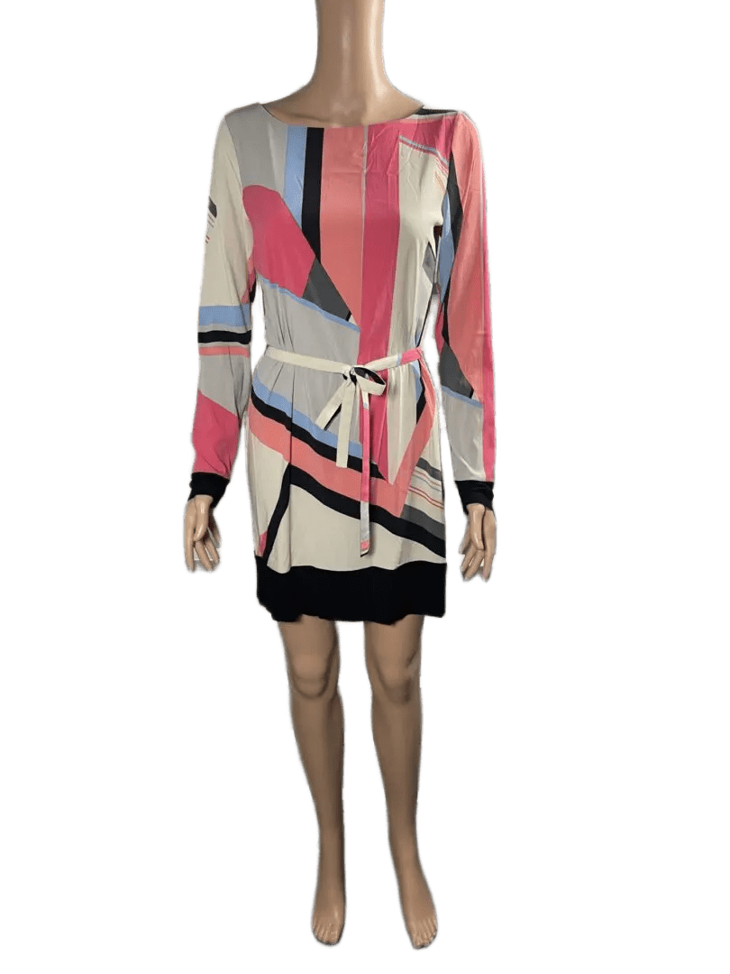 Woman wearing a colorful striped dress with a belt.