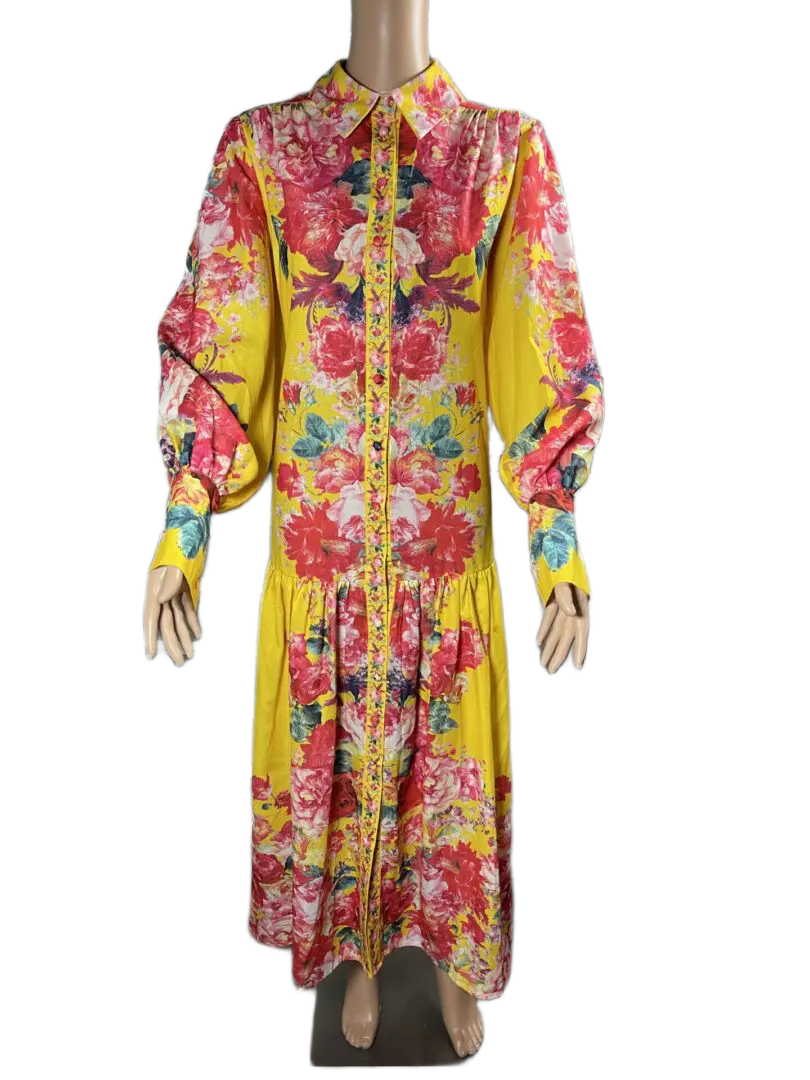 A vibrant floral print long dress with puffed sleeves.