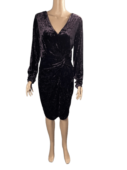 Elegant black velvet long-sleeve dress with a draped design.