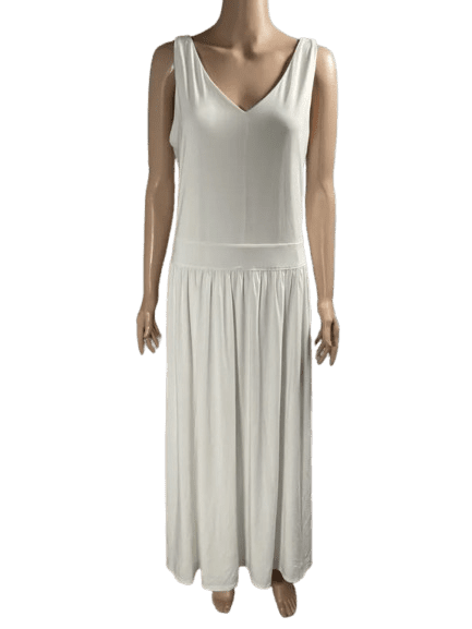 Woman wearing a sleeveless white maxi dress with a V-neck.